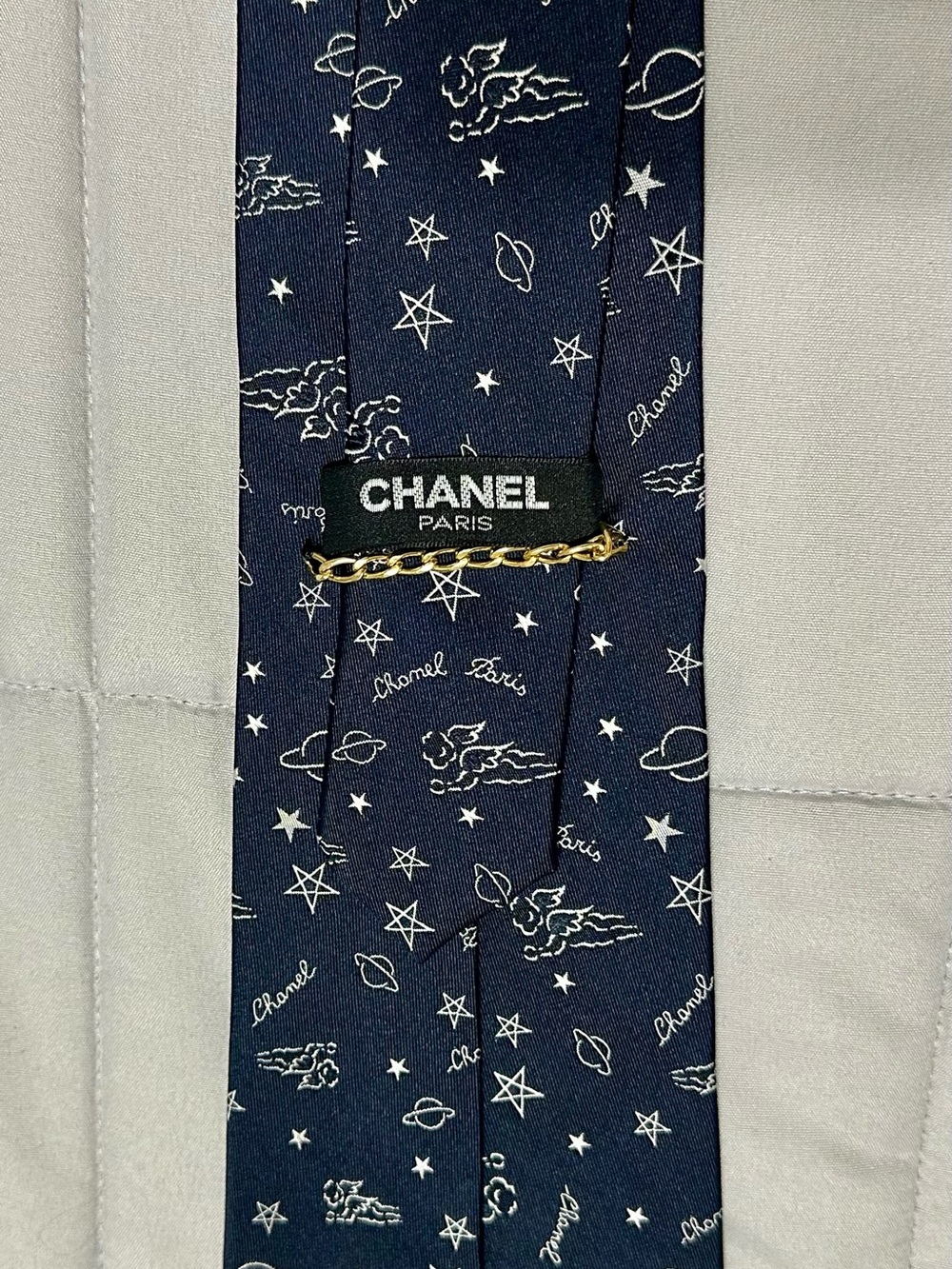 CHANEL Navy Silk Tie with White Celestial Motifs and Gold Chain